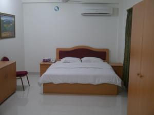 Letto o letti in una camera di Plaza Hotel