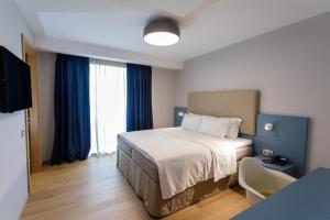 Postel nebo postele na pokoji v ubytování Buzë Boutique Hotel