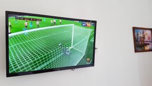 A television and/or entertainment centre at Efstathiou Mihail Studios and Apartments