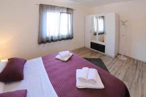 Postel nebo postele na pokoji v ubytování Apartment Petar