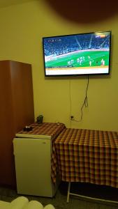 A television and/or entertainment centre at Efstathiou Mihail Studios and Apartments
