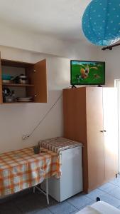 A bed or beds in a room at Efstathiou Mihail Studios and Apartments