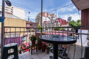 a table on a balcony with a view of a city at Квартира у бульвара 1 in Batumi