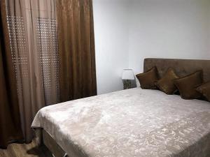 Postel nebo postele na pokoji v ubytování Eko Apartmani Krackovic