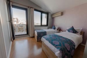 Postel nebo postele na pokoji v ubytování ROYAL TAKSIM SUITES + 37 fotografií
