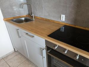 a kitchen with a sink and a stove at Luxury Holiday Home in Bibinje near Sea in Bibinje