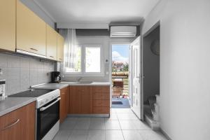 A kitchen or kitchenette at Nikiti Maisonette on the beach by Luxlikehome