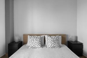 A bed or beds in a room at Nikiti Maisonette on the beach by Luxlikehome
