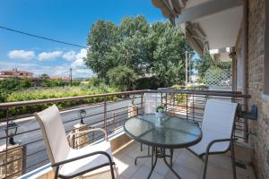 A balcony or terrace at Nikiti Maisonette on the beach by Luxlikehome