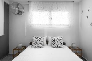 A bed or beds in a room at Nikiti Maisonette on the beach by Luxlikehome