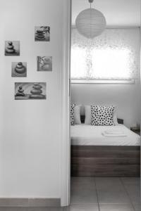 A bed or beds in a room at Nikiti Maisonette on the beach by Luxlikehome