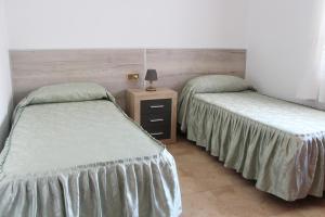 Cama o camas de una habitación en Apartamentos Las Americas - Blanes Beach