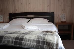 Postel nebo postele na pokoji v ubytování Ostrivky