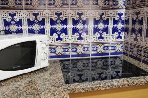 Una televisión o centro de entretenimiento en Apartamentos Las Americas - Blanes Beach