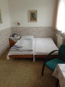 מיטה או מיטות בחדר ב-Ubytování Zmatlíková