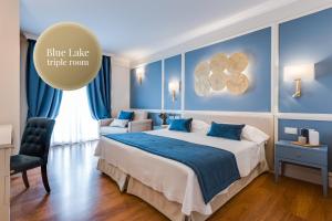 Postel nebo postele na pokoji v ubytování Madrigale Panoramic Lifestyle & Soulful Hotel