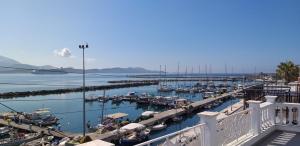 a view of a marina with boats in the water at La Maison Bleue in Lixouri