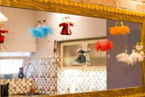 a mirror with dresses on display in a room at Sofia Apartment in old Tbilisi in Tbilisi City