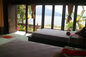 Llit o llits en una habitació de Batur Green Lake