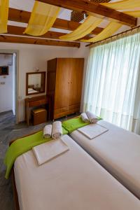 Posteľ alebo postele v izbe v ubytovaní Iris Apartments