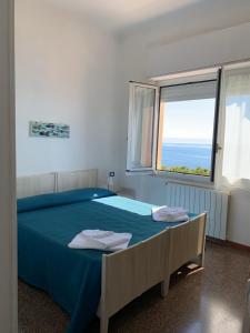 Ένα ή περισσότερα κρεβάτια σε δωμάτιο στο Albergo Miramare