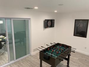 a large foosball table in a room with at Near Beaches & IMG Academy, Mins to Downtown in Bradenton