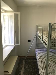 מיטה או מיטות קומותיים בחדר ב-Appartamenti Morini