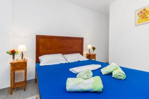 Postel nebo postele na pokoji v ubytování Apartment Skroza 2