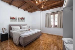 A bed or beds in a room at Ariadni Villas Faliraki