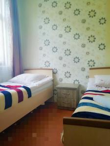 Guest House Carpediem tesisinde bir odada yatak veya yataklar