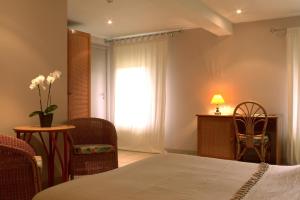Postel nebo postele na pokoji v ubytování Hotel Le Beau Séjour