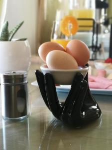 a bowl of eggs sitting on a kitchen counter at Dimitris Villa Hotel in Matala