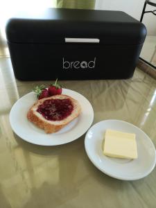 a plate with a piece of bread and a piece of cheese at Dimitris Villa Hotel in Matala