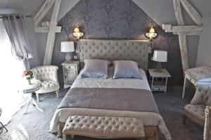 Ein Bett oder Betten in einem Zimmer der Unterkunft La Bergerie des Anges