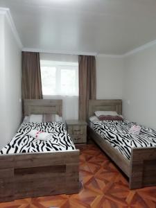 Voodi või voodid majutusasutuse Guest House Carpediem toas