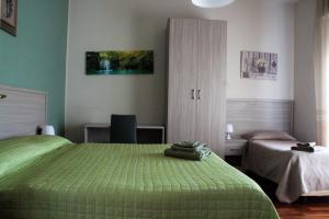 Postel nebo postele na pokoji v ubytování B&B Domus Benedicta