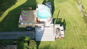 an aerial view of a house with a swimming pool at Holiday home Le Pressoir in Domfront