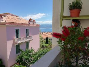 a view from a balcony of a building with flowers at Villa Cécile in Ajaccio