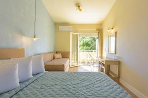 Posteľ alebo postele v izbe v ubytovaní Panas Hotel