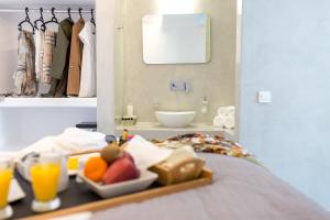 A bed or beds in a room at Dreaming View Suites