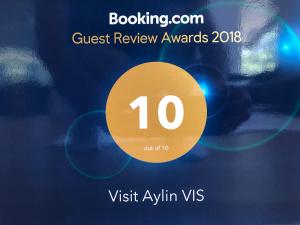 a sign that says guest review awards with a yellow circle at VisitAylinVis in Vis