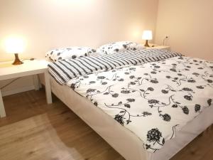 Posteľ alebo postele v izbe v ubytovaní White Rose apartment