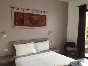 Postel nebo postele na pokoji v ubytování Sairee Sairee Guesthouse