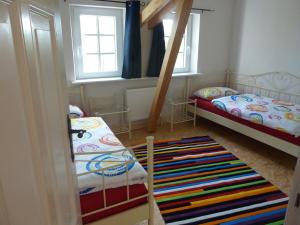Ένα ή περισσότερα κρεβάτια σε δωμάτιο στο Ferienwohnung Landtraum