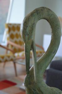 a statue of a green swan in a room at JULIA LUXURY SUITE in Udine