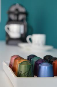 a close up of a tray of different colored chocolates at JULIA LUXURY SUITE in Udine