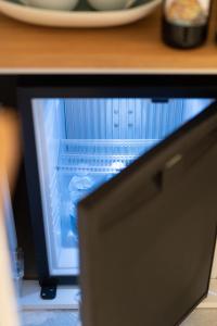 Televízia a/alebo spoločenská miestnosť v ubytovaní L'EMPORIO ROOMS