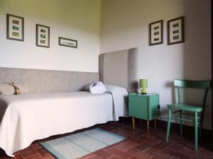 Ένα ή περισσότερα κρεβάτια σε δωμάτιο στο Agriturismo Piemaggino