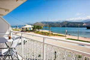 a balcony with a view of the water at Metela apartment in Argostoli