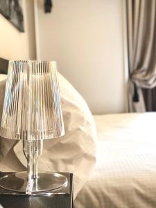 Postel nebo postele na pokoji v ubytování Bue Nero Suites Verona + 27 fotografií